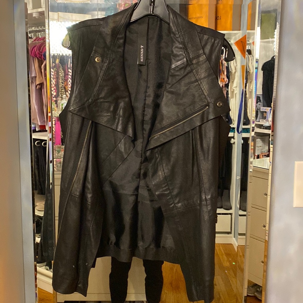 Kenna-T leather vest with front zipper pockets.